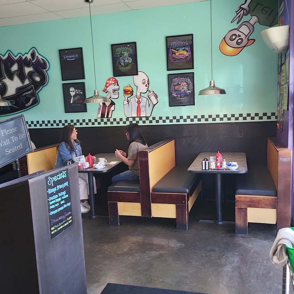 American diner seating with warm, simple decor.