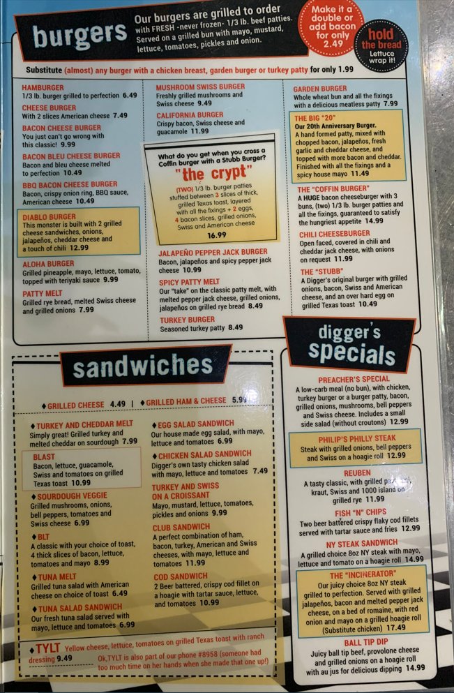 Printed diner menu featuring breakfast and burgers.